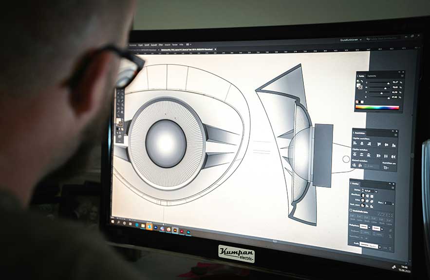 designer using best free cad software to create 3D technical drawing on screen