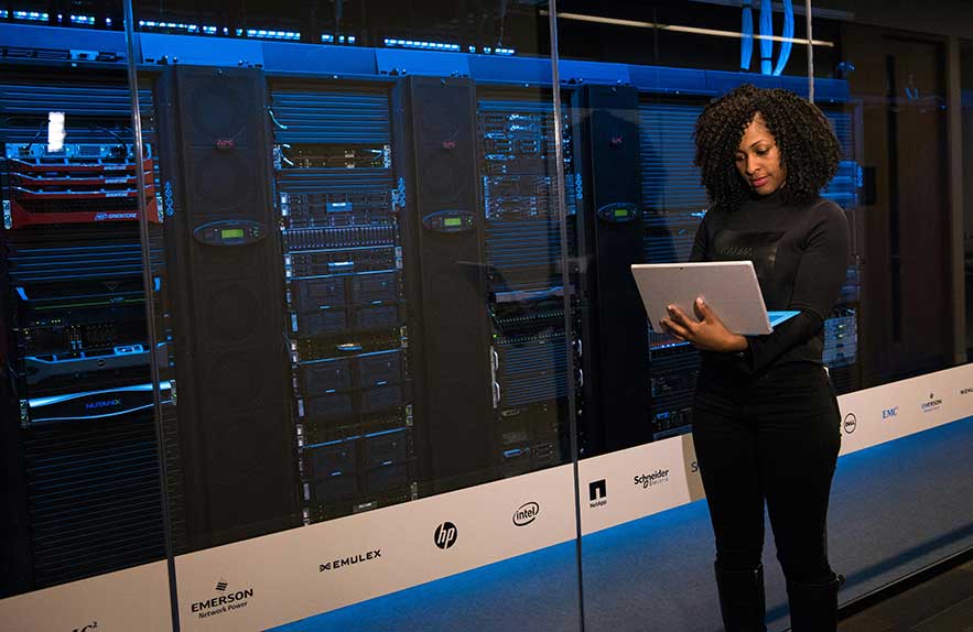 woman managing cloud server for small business in data center