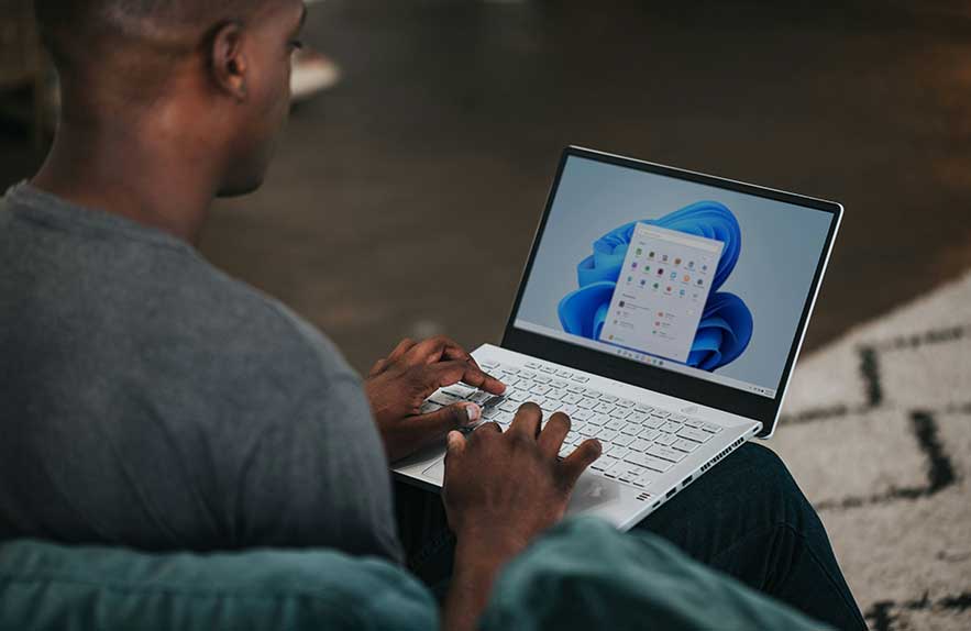 User accessing Windows startup settings on a laptop to manage startup apps