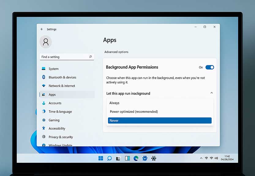 turn off background apps in windows 11 using settings app on a laptop screen